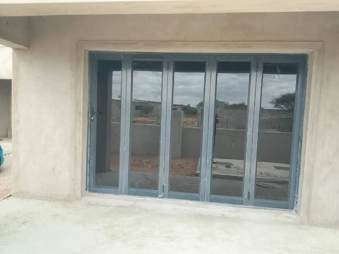 Five-panel aluminium bifold door installed in a Botswana home — Tshipiworks