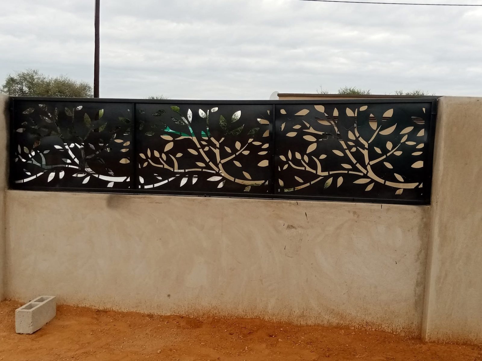 Black laser-cut decorative tree and leaf steel wall panel — Tshipiworks Gabane