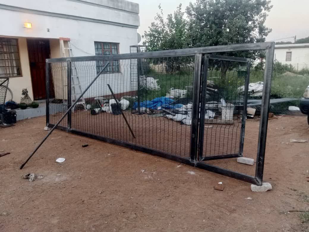 Raw steel sliding gate frame during on-site fabrication — Tshipiworks Botswana