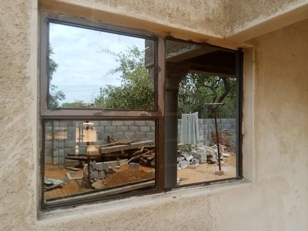 Four-pane brown steel window on a Mochudi new build — Tshipiworks