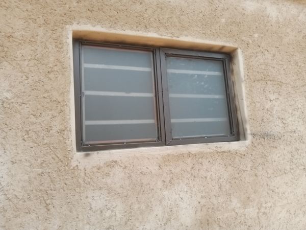 Small steel window with frosted glass for a bathroom, Mochudi — Tshipiworks